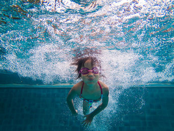 Girl swimming in pool