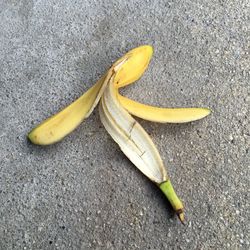 Close-up of banana peel on road