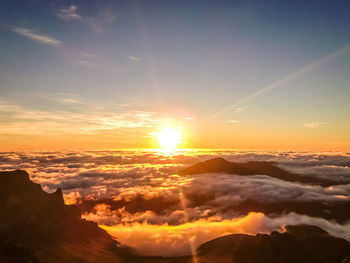 Scenic view of mountains against sky during sunset