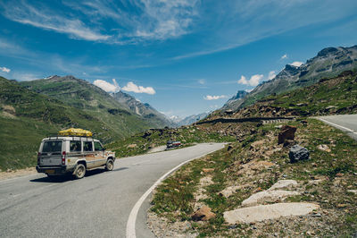 High angle view of road by mountain against sky