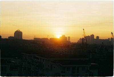 High angle view of buildings against sky during sunset