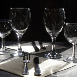 Close-up of wine glasses on table