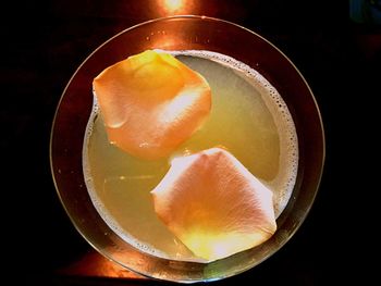 Close-up of lemon slice in plate on table