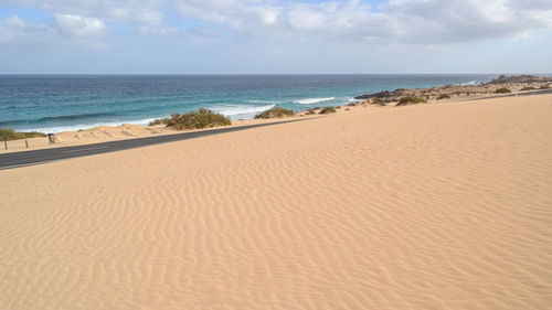 Scenic view of beach against sky