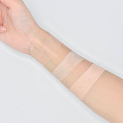 Low section of woman wearing canvas shoes