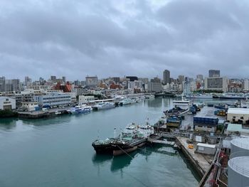 Boats moored at harbor