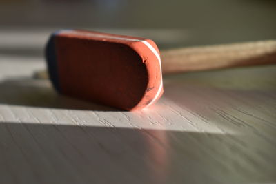 Close-up of pencil and eraser on table