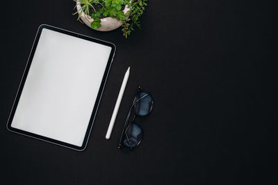 High angle view of smart phone on table