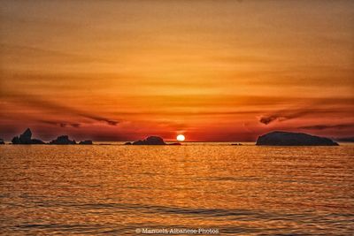 Scenic view of sea against sky during sunset