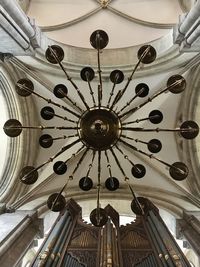 Low angle view of chandelier hanging on ceiling in building