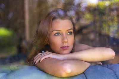 Portrait of young woman looking away