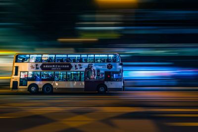 Blurred motion of train on road at night