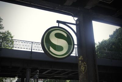 Low angle view of road sign against sky