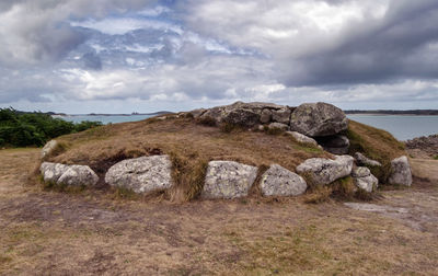 Rocks on land against sky