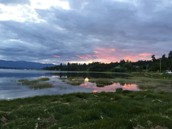 Scenic view of lake against sky during sunset