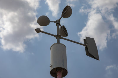 Low angle view of street light against sky