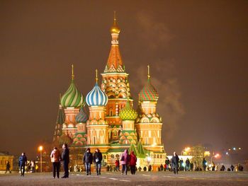 Group of people in front of building at night