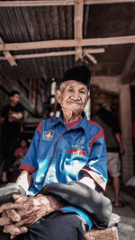 Portrait of man sitting outdoors