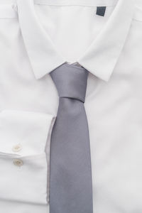 Close-up of necktie against white background