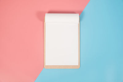 Close-up of paper against blue background