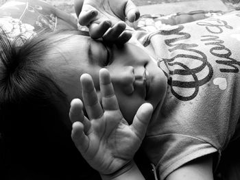 Close-up portrait of baby lying down on bed