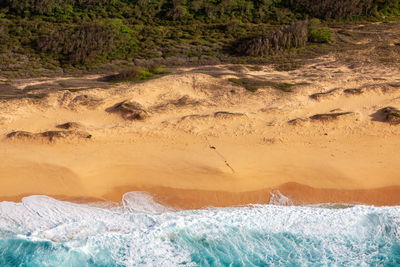 Aerial view of waves on beach