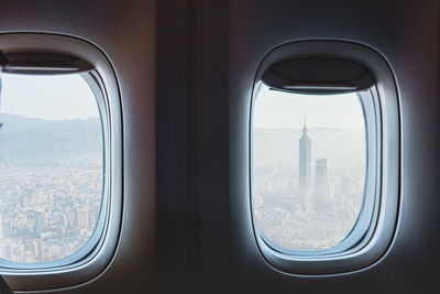 View of cityscape seen through airplane window