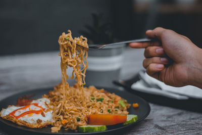 Close-up of hand holding food