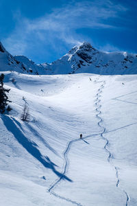 Man walking on snowcapped mountain