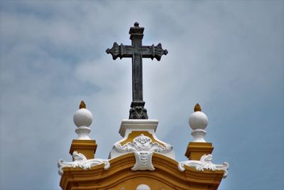 Low angle view of statue against sky