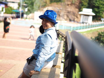 Side view of boy wearing hat