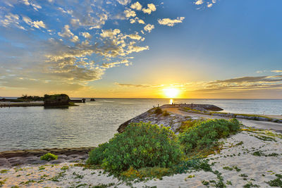 Scenic view of sea against sky during sunset