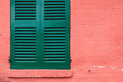Close-up of closed window on wall of building