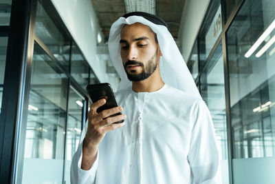 Young man using mobile phone