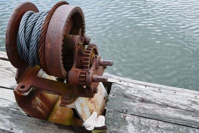 High angle view of rusty metal by lake