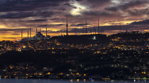 Illuminated buildings in city at night