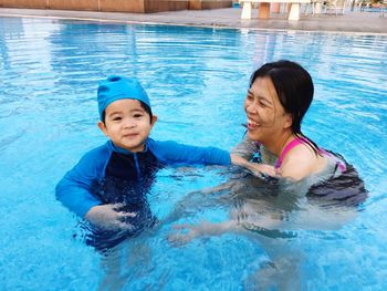 High angle view of woman swimming in pool