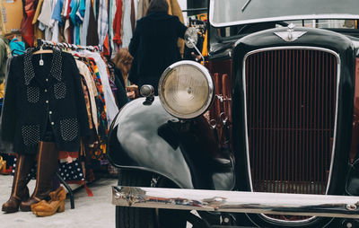 Close-up of vintage car on street in market