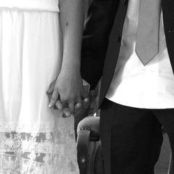 Low section of man and woman standing on floor