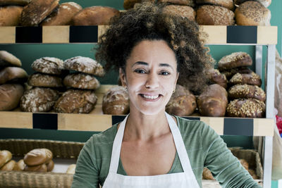 Portrait of smiling female owner in bakery