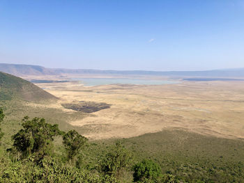 Scenic view of dramatic landscape against clear blue sky