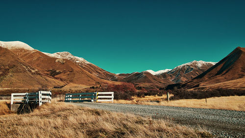 Scenic view of mountains against clear blue sky