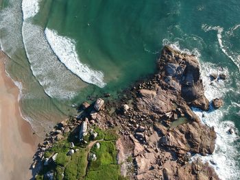 High angle view of rock formation in sea