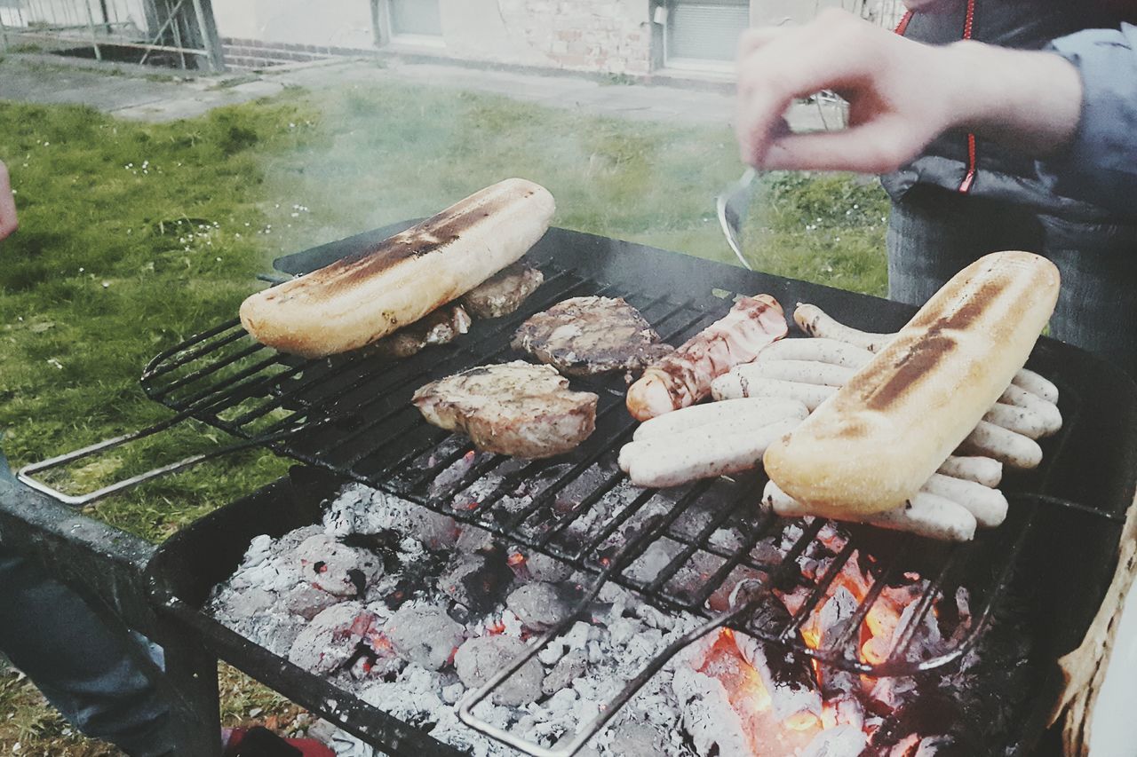 food and drink, food, freshness, person, meat, barbecue grill, preparation, holding, barbecue, preparing food, cooking, lifestyles, grilled, part of, people, healthy eating, high angle view