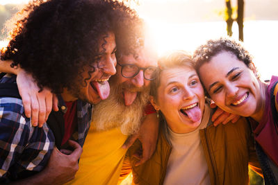 Portrait of smiling friends at home