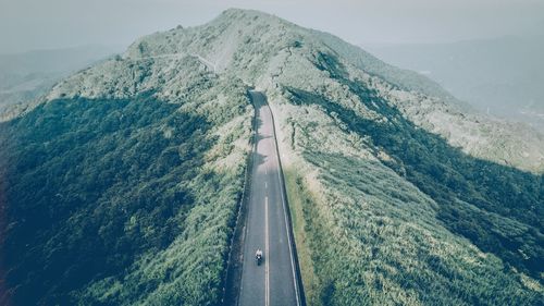 High angle view of road amidst mountains against sky