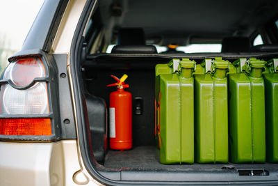 Gas canisters in car trunk. fuel crisis concept