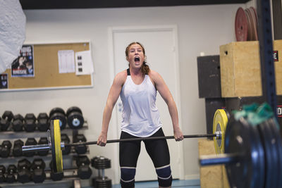 Woman weightlifting in gym