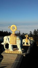 Close-up of statue against clear blue sky