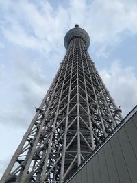 Low angle view of tower against cloudy sky